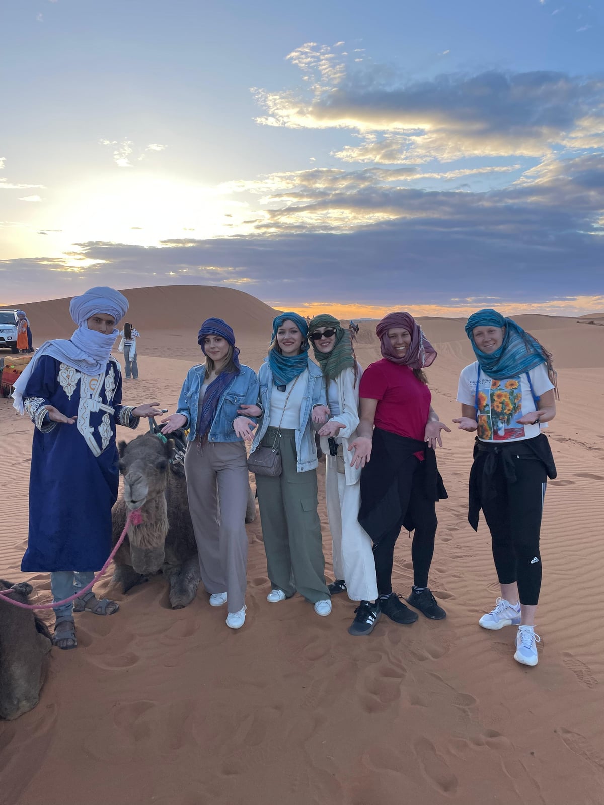 Camel ride at sunset in Erg Chebbi dunes during a 3 day desert tour from Marrakech to Fes